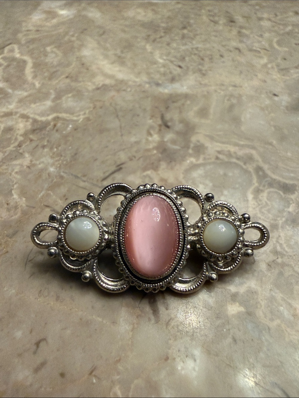Vintage 1928 brand Silvertone petite brooch with glass, pink and moonstones